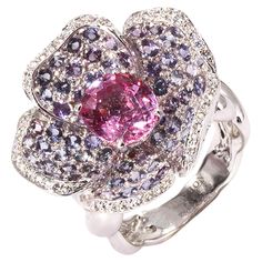 Anémone ring by Mathon Paris at Second Petale Gallery Explore an enchanted universe and witness the vivid colors gemstones with the Anémone ring in purple and pink sapphires, diamonds and white gold. About the Gemstones : Diamonds (0,25 ct) Purple Sapphires (2,69 ct) Pink Sapphires (2,68 ct) ABOUT the CREATOR MATHON PARIS : FRENCH STYLE SINCE 1931 "JOAILLERIE DE FRANCE" label "Living Heritage Company" French State excellence "RESPONSIBLE JEWELLERY COUNCIL" certificate Maison Mathon Paris is the story of a 4-generation family that makes jewelry for the great houses of Place Vendôme, as well as own label creations. Mathon's identity is based on colors and an exceptional savoir-faire in which they have become specialists: lacquering, sculpting, hand engraving, gold texturing, chasing. All sta International Jewelry, Purple Sapphire, White Gold Ring, Sapphire Diamond, Hand Engraving, French Style, Pink Sapphire, Cocktail Rings, White Gold Rings