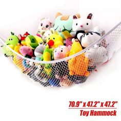 the toy hammock is full of stuffed animals and has mesh netting around it