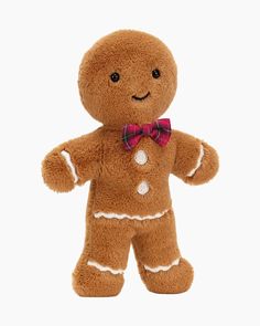 a brown teddy bear with a bow tie on it's head and chest, wearing a ginger costume