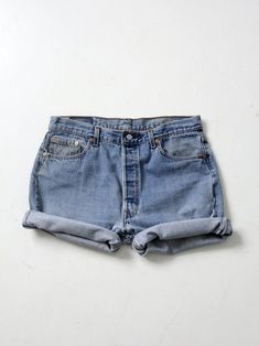 "This is a pair of vintage Levis 501 denim cutoffs. Lots of great wear and frayed hems make for classic jean shorts. Length allows for rolled hems. They have five pockets and button fly closure. CONDITION In good condition with wear consistent with age and use. Repair stitches near button fly. MARKED SIZE: 36 MEASURED SIZE: 35 MEASUREMENTS Waist 35\" .. 88.9 cm Inseam: 5.5\" .. 14 cm Hips: 46\" .. 116.8 cm Rise: 12\" .. 30.5 cm 52140" Repair Stitches, Levis Shop, Pucci Dress, Expensive Dresses, Pucci Vintage, Hippie Boots, Vintage Levis 501, Vintage Clothing Online, Denim Cutoffs