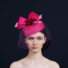 Exquisite hot pink silk pill box with hand craft red silk roses, a bird cage veil and light pink diamond feathers. This statement piece would be excellent for Ascot or mother of the bride. This pink silk pill box hat is handmade in my studio in Exeter. Love this look, but need it in another colour to match your outfit, send us an photograph of your outfit and state the colours you would like for the sinamay, twirls. See colour chart. There will be a £20 surcharge for bespoke items. We look forward to hearing from you. Pill Box Hat, Pink Veil, Casual Hats, Pink Fascinator, Box Hat, Bride Hat, Shocking Pink, Birdcage Veil, Wedding Hat