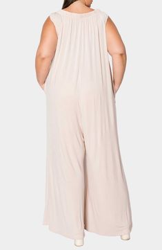 Soft and breathable fabric means all-day comfort in this versatile jumpsuit that's completed by graceful flowy legs and handy side pockets. 59" length Jewel neck Sleeveless Side-seam pockets Unlined 95% rayon, 5% spandex Machine wash, tumble dry Made in the USA of imported fabric Spring Strapless Jumpsuit With Elastic Waistband For Loungewear, Beige Jumpsuits And Rompers With Elastic Waistband For Spring, Solid Color Sleeveless Relaxed Fit Jumpsuit, Sleeveless Jumpsuits And Rompers With Side Pockets For Loungewear, Casual Strapless Sleeveless Jumpsuit With Elastic Waistband, Casual Strapless Jumpsuit With Elastic Waistband, Spring Strapless Sleeveless Jumpsuit With Elastic Waistband, Solid Color Wide Leg Jumpsuits With Elastic Waistband, Beige Sleeveless Jumpsuits And Rompers For Loungewear