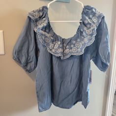 Nwt. S, M, And L Available. Elastic Neckline, Can Be Worn Off Shoulder Too. Sleeves Hit At Elbow And Have Elastic As Well. 100% Lyocell Spring Short Sleeve Denim Top With Ruffles, Spring Denim Top With Ruffles And Short Sleeves, Spring Denim Top With Ruffles Short Sleeve, Denim Blue Ruffled Short Sleeve Top, Short Sleeve Denim Top With Ruffles, Spring Ruffled Medium Wash Denim Top, Spring Medium Wash Denim Top With Ruffles, Ruffled Short Sleeve Denim Top, Denim Blue Short Sleeve Top With Ruffles