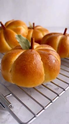 rolls on a cooling rack lined with leaves