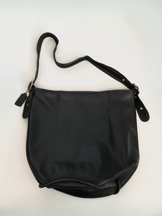 "Black soft buttery leather shoulder hobo bag. Exterior leather is good condition, interior has some markings/old stickers stuck on the bottom. Closes with a brass zipper. Adjustable leather strap. Has a tag that says Rumor. 13\" tall x 16\" wide ALL SALES FINAL" Vintage Black Hobo Shoulder Bag, Black Vintage Hobo Shoulder Bag, Vintage Black Hobo Bag, Vintage Black Crossbody Hobo Bag, Vintage Black Hobo Bag For Daily Use, Vintage Soft Leather Hobo Shoulder Bag, Vintage Soft Leather Hobo Bag, Classic Leather-backed Satchel Hobo Bag, Vintage Black Hobo Bag For Everyday