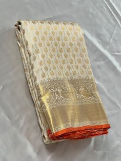 Bridal Collection White Color Pure Kanchipuram Silk Saree | Indian Traditional Ethnic Saree | Wedding or Party Wear Saree | Handwoven Gift Saree for Her Product Details : Saree Type : Pure Kanchipuram Silk Saree Golden Zari, Silk Mark Certified Blouse Piece : Yes (Un-Stitched) Saree Length : 5.5 Meters Blouse Piece Length : 80 cm Saree Weight : 0.9 kg Saree Fabric : Pure Kanchipuram Silk  Color : As shown in the picture Work : weaving Pattern : designer Occasion: Party Wear, Formal Wear, Festiva Gold Pre-draped Saree With Traditional Patterns For Festivals, Traditional Ceremonial Pre-draped Saree With Cutdana, Bollywood Style Off White Pre-draped Saree With Pallu, Semi-stitched Paithani Silk Saree For Wedding, White Cutdana Pre-draped Saree For Puja, Traditional White Pre-draped Saree With Self Design, Traditional Pre-draped Cream Saree, Eid Cutdana Pre-draped Saree For Puja, Traditional Off White Chanderi Pre-draped Saree