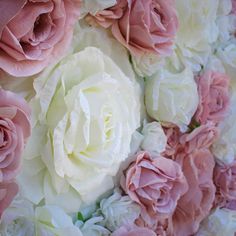 pink and white flowers are arranged in a circle