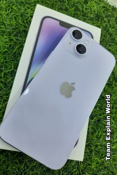 the new iphone 11 is in its box on the grass with it's lid open