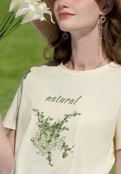 Bask in the pastoral allure of our Cottagecore Natural Tee. This breathable cotton-polyester top showcases high-quality floral embroidery. It's an idyllic addition to your wardrobe, evoking a serene, nature-inspired vibe, setting you apart from the urban crowd. Cottagecore aesthetic Cotton, polyester Crew neck High quality floral embroidery at front Short sleeve Spring Floral Embroidered Short Sleeve Tops, Cream Cottagecore Top For Spring, Spring Crew Neck Tops With Floral Embroidery, Cream Floral Embroidered Summer Tops, Cream Crew Neck T-shirt For Spring, Beige Short Sleeve Tops With Floral Embroidery, Floral Applique Short Sleeve Tops For Summer, Cream Cotton T-shirt For Spring, Beige Floral Embroidery Top For Spring