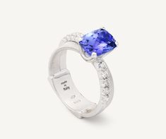 In this elegant 18K white gold ring, a carefully selected 2.33 ct cushion-cut tanzanite is nestled on flat coil thread, finely handcrafted with the brand’s exclusive coil technique, and surrounded with an elegant brilliant-cut diamond band. The result is a refined and timeless ring perfect for a heartfelt gift. Double Band Rings, Timeless Ring, Bangles Style, White Gold Ring, Diamond Band, Heartfelt Gifts, High Jewelry, Cushion Cut, Birthstone Jewelry