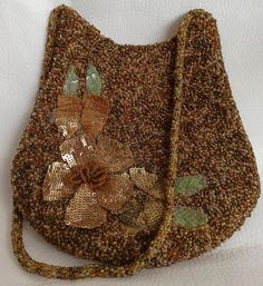 It is made by hand embroidering beads and sequins. Production date unknown. Unused, antique vintage bag. The interior is satin lined. There is a pocket. The handle is hand-woven with beads.  Bag; Length: 17cm Bottom width: 17cm Width top: 14cm Handle length: 26 cm Vintage Embellished Pouch Bag, Vintage Gold Bag With Handwork, Vintage Gold Bags With Handwork, Vintage Evening Bag With Handwork, Vintage Gold Handcrafted Bag, Vintage Beaded Shoulder Bag For Everyday Use, Vintage Embellished Rectangular Shoulder Bag, Vintage Embellished Evening Bag, Gold Vintage Bags