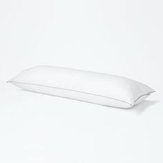 a white pillow sitting on top of a table