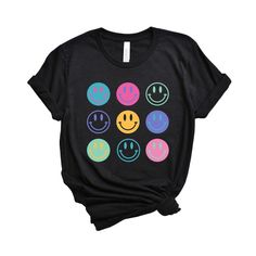 Looking for a cute versatile top to wear this summer? Make sure to grab one of our Stacked Smiley Faces tees! This soft and comfortable graphic tee is the perfect top for any outfit. It can be paired with biker shorts, jeans, or even a simple skirt/dress! This tee is true-to-size, so be sure to order your regular t-shirt size! If you are looking for a more oversized look, make sure to size up! Cute Graphic Design T-shirt For Summer, Fun Slogan T-shirt For Everyday, Trendy Multicolor T-shirt With Text Print, Cute Black T-shirt With Graphic Design, Casual Multicolor T-shirt With Funny Print, Fun Graphic Print T-shirt For Everyday, Everyday Fun T-shirt With Graphic Print, Black Graphic Tee With Funny Print, Black Graphic Print T-shirt For Everyday