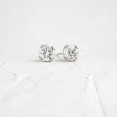 A pair of matching round brilliant cut diamonds in your choice of natural or lab-grown diamond. Please note: these earrings are listed with the total carat weight for both studs together. Each diamond is SI+ clarity, G+ color. Solid 14k gold posts and butterfly backings. Also available in platinum. Sold as a pair. We handcraft each piece with responsibly sourced metals and ethically sourced stones. Gold Diamond Stud Earrings, Studs Diamond, Melanie Casey, Traditional Diamond, Studs Earrings, Round Moissanite, Diamond Stud Earrings, Delicate Jewelry, Diamond Stud