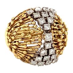 This lovely 1960s diamond dome ring in 18K yellow gold is intricately styled with a distinctive wire and beaded design. Centering 21 round brilliant cut diamonds totaling approximately 1.35 carats, this ring glistens with diamonds of G color and VS-2 clarity, set elegantly within the detailed gold dome. Measuring 22 millimeters across the top portion, this ring is stamped "M18K," authenticating its quality. Sized at 7.25 and weighing 13 grams, it’s a stylish and intricate piece with a charming v Motifs Perler, Estate Rings, Dome Ring, 18k Yellow Gold Ring, Domed Ring, Yellow Gold Ring, Bead Designs, Round Brilliant Cut Diamond, Brilliant Cut Diamond