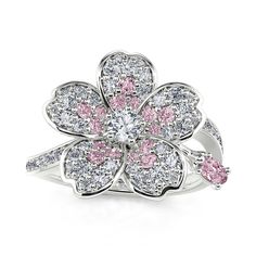 Fresh and feminine, this shimmering flower ring is sweet as can be. Crafted in sterling silver, this girly design features a round cut white center stone surrounded by a vibrant petal frame of dazzling bright pink and white stones. Destined to be adored, this charming ring is buffed to a brilliant luster.Carat Weight: 2.273 ctStone Size: 0.8,1.2,1.5,3,1.2,1.5,2*3 mmStone Type: Jeulia® StoneNumber of Stones: 77 Stone Color: Diamond White, Fancy PinkStone Shape: Round, OvalWeight: 3.33 gMaterial: Fancy P, Artistic Earrings, Girly Design, White Stones, Presents For Her, Classy Jewelry, Pretty Rings, Affordable Jewelry, Flower Ring