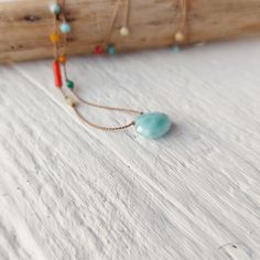 Dainty natrual larimar  necklace  with various gemstones randomly handknotted along the thread. Perfect eyecatching piece  to wear over summer outfits. To complement the center stone I chose:  Mediterranean coral, turquoise, larimar, yellow and white agate. You will wear a unique piece,  I'll make every one different but very similar.  If you prefer the prevalence of a color/stones please get in touch, when possible I'll be happy to customize it for you. Sterling silver spring clasp . Total leng Artisan Blue Amazonite Necklaces, Larimar Gemstone Bead Necklaces For Gifts, Larimar Gemstone Beads Necklace As Gift, Larimar Gemstone Beads Necklace For Gift, Adjustable Turquoise Necklace As A Gift, Adjustable Turquoise Necklace For Gift, Adjustable Light Blue Turquoise Necklace Gift, Bohemian Larimar Necklace For Gift, Blue Amazonite Necklaces For Gift