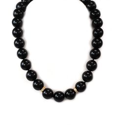 "Hallmark: 14k Material: 14k yellow gold Diamond: 15 points Gemstone: onyx beads (13.5mm - 13.8mm) Measurements: 15.5\" long x 13.8mm Weight: 94.9 grams This is an elegant beaded necklace. It features a single strand with high polished onyx beads 3.5-3.8mm in size. The center of the necklace has two 14k yellow gold ring between the beads and it has round cut sparkling diamonds. The yellow gold clasp is a long floral filigree design with a hook and push in closure. It has the 14k metal content st Formal Black Jewelry With Gemstone Beads, Formal Black Gemstone Beads Jewelry, Formal Black Jewelry With Large Beads, Black Round Jewelry With Large Beads, Elegant Beaded Necklace, Floral Filigree, Tourmaline Beads, Filigree Design, Onyx Bead