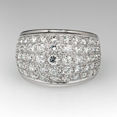 This wonderful domed ring is accented with seventy-five (75), bead set, round brilliant/single cut diamonds. The ring measures 13.7mm at the top, rises 5.9mm above the finger, tapering to 4.8mm wide and 1.0mm thick at the base of the shank. This ring is currently a size 6.5 and resizing is not recommended. Luxury Wide Band Ring With Single Cut Diamonds, White Diamond Dome Ring For Formal Occasions, Modern Wide Band Diamond Ring For Formal Occasions, Elegant Wide Band Ring With Brilliant Cut For Wedding, Luxury Wide Band Diamond Ring With Accents, Wide Band Diamond Ring With Pave Setting, Elegant Wide Band Wedding Ring, Brilliant Cut, Formal White Diamond Dome Ring, Luxury Dome Ring With Diamond Cut For Formal Occasion