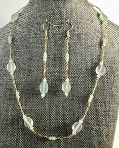 Faceted aquamarine coins surrounded w/ jade & aventurine rondells & tiny round clear Swarovski crystals--gold filled Figaro decorative chain w/ handmade hook  & eye closure. Single wrap 18 1/2" w/ matching earrings--beautiful color & sparkle. AQUAMARINE---protects all who travel over water--calming, soothing & cleansing--is associated w/ tranquility, serenity, clarity & harmony--represents transformation & rebirth.  Celebrates: aquamarine--MARCH BIRTHSTONE---zodiac stone for Pisces (Feb19Mar20) & Scorpio (Oct24Nov22)--18th & 19th anniversaries. JADE---helps w/ prosperity, wellbeing & enjoying being alive--associated w/ good health, wealth & love--useful to treat stress, anxiety & disorders of blood circulation. AVENTURINE---"stone of opportunity"--helps w/ maintaining energy & optimism in 19th Anniversary, Zodiac Stones, Aventurine Stone, March Birthstone, Health Wealth, Blood Circulation, Hook Eye, March Birth Stone, Good Health