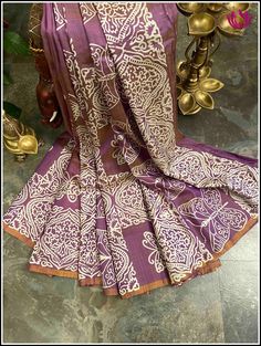 Drape yourself in elegance with this beautiful Bishnupuri Katan Silk Saree. Crafted with lightweight silk and featuring a dual shade of purple with a golden hue, it has a versatile style perfect for evening parties and casual wear. Its hand block printed, butterfly prints and elegant design make it the perfect choice for any occasion. Certified by Silk Mark, this saree is sure to turn heads. Styling tip: Accessorize with german silver jewelry for a super trendy look. Fall and Pico - done Blouse Block Print Saree, German Silver Jewelry, Printed Sarees, Butterfly Print, Shades Of Purple, Silk Sarees, Block Print, Elegant Design, Casual Wear