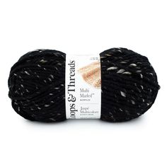 a ball of yarn with black and white speckles