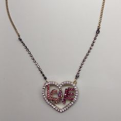 Hot Pink And Magenta Rhinestone Love Surrounded By 2" X 1-1/2" Rhinestone Heart. Rhinestones Accent The Chain For 2-1/2" On Each Side Closest To Pendant. 18" Gold Chain Including 3" Extender. Lobster Claw With Gold Betsey Heart. Retail - $48. Nwt Pink Rhinestone Necklace For Valentine's Day, Crystal Rhinestone Heart Necklace For Valentine's Day, Gold Crystal Rhinestone Necklace For Valentine's Day, Pink Heart-shaped Necklace With Rhinestones, Pink Heart-shaped Rhinestone Necklace, Valentine's Day Gold Crystal Rhinestone Necklace, Purple Necklaces For Valentine's Day Party, Purple Necklace For Valentine's Day Party, Valentine's Day Crystal Necklace With Rhinestones