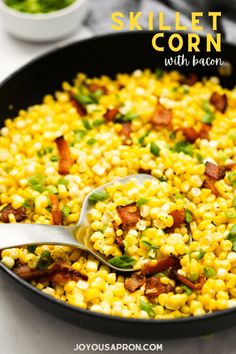 a skillet filled with corn and bacon