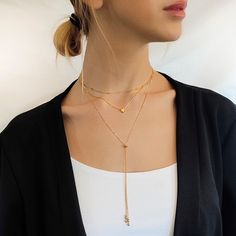 "Add a Touch of Elegance to Your Look with this Dainty Lariat Necklace - Featuring a Sliding Bead for adjusting the Closure Point on your Cleavage. ◾ This design has no closure part. It goes over your head while moving the sliding bead on the chain to open or close the circle. ◾ Length - The necklace length is 27\". The drop chain part is versatile according to where the sliding bead is placed on the chain. ◾ Material - Available in silver or gold Gold necklace - Gold Micron plating over sterlin Adjustable Dainty Lariat Choker Necklace, Minimalist Adjustable Layered Clavicle Necklace, Dainty Adjustable Lariat Choker Necklace, Adjustable Elegant Layered Necklace, Adjustable Lariat Layered Necklace, Adjustable Dangle Lariat Necklace, Elegant Adjustable Dangle Layered Necklace, Adjustable Long Drop Necklace, Adjustable Long Layered Minimalist Necklace