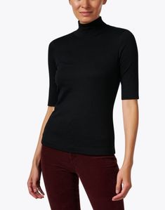 Marc Cain's mock neck top is a wardrobe staple that's sure to be worn for seasons to come. This slim-fitting style is cut from comfortable stretch cotton and features a mock neckline and elbow length sleeves. Perfect for layering or styling solo, pair yours with your favorite jeans and leather flats for a polished off-duty ensemble. Classic Fitted T-shirt For Fall, Classic Mock Neck Top For Layering, Classic Mock Neck Top With Funnel Neck For Spring, Classic Mock Neck Top For Spring, Solid Fitted Turtleneck T-shirt, Fitted Solid Color Turtleneck T-shirt, Fitted Turtleneck T-shirt In Specific Color, Classic Mock Neck Top For Spring Layering, Classic Stretch Mock Neck Top For Layering