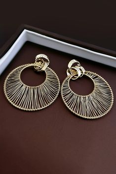 Elevate your style with our Metal Hollow Large Circle Earrings. These striking earrings feature intricate metalwork in a bold circular design, adding a touch of elegance to your look. Crafted with high-quality materials, they not only enhance your allure but also exude sophistication. Perfect for formal occasions, cocktail parties, or when you want to make a statement with your outfit, these earrings are the ideal choice to complement your ensemble with a touch of contemporary charm. Gold Hoop Earrings In Alloy, Hoop Alloy Jewelry For Party, Elegant Gold Alloy Hoop Earrings, Party Hoop Alloy Jewelry, Round Alloy Earrings For Parties, Gold Alloy Hoop Earrings, Trendy Hoop Earrings Made Of Alloy, Gold Hoop Alloy Jewelry, Trendy Alloy Hoop Earrings