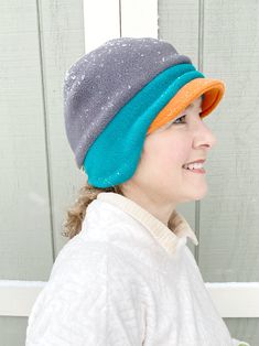 "OMG!!!! Never knew a hat that would fit perfect, is very comfortable, soft, and keeps my ear warm too...all in one, wow!" - Gail, TX Women's Fleece Beanie Hat A NEW Trio of Colors Hat! This anti-pill fleece newsboy hat is designed with function, style and you in mind. Need more color in your life? Yes! Triple your fun in the new fleece hat color combo in a pre-selected trio of yummy fleece colors! Whether you're shoveling the driveway or tackling the big grocery day on a blustery winter day - d Windproof Beanie Hat One Size, Windproof Beanie One Size, Warm Hats For Winter Sports, One Size Fits Most, Windproof Winter Visor Hat, Winter Windproof Visor Hat, Warm Adjustable Visor Hat, Fleece Lined Beanie Hat, One Size Fits Most, Beanie With Fleece Lining, One Size Fits Most, Fleece-lined Beanie Hat, One Size Fits Most