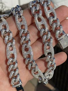 Men's figarucci gucci cuban link chain
We have it from 18" to 30" so wear as a mens choker or as a longer bust down link
 
Heavy 150-250 grams depending on length!
12mm wide so it’s a thick yet not too gaudy
 
60ct man made diamonds
Gorgeous baguette & round stones 
You can’t tell difference from natural diamonds without a microscope 
Super ICY you have to see to believe!!
 
Solid 925 silver
Will never turn!! This is SOLID silver! Grea Silver Cuban Link Chain Necklace Iced Out, Silver Iced Out Cuban Link Necklace, Iced Out Silver Cuban Link Necklace, White Gold Cuban Link Necklace With Figaro Chain, Silver Sterling Cuban Link Necklace With Figaro Chain, Silver Cuban Link Necklace With Figaro Chain As Gift, Cuban Link Necklace With Lobster Clasp, Luxury Silver Cuban Link Necklace With Figaro Chain, Sterling Silver Cuban Link Chain Necklace With Lobster Clasp