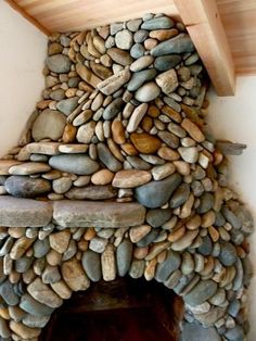 a fire place made out of rocks and wood