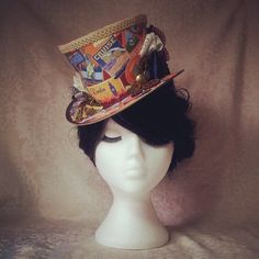 Womens Top Hat , Steampunk hat, Steampunk Adventurer, Steampunk Explorer, Festival hat, Carnival hat, Steampunk midi hat, Steampunk costumeDecorated using decoupage and Victorian scrapbook techniques, this hat is called the 'Seasoned Traveller'. I use a fabulous range of fabrics to cover my hats, steam pressed into place to prevent unsightly wrinkles or gathers. I decorate my hats with a carefully selected mix of quality, vintage and upcycled ribbons, charms, feathers and trimmings. Based on aut Fitted Punk Hats For Cosplay, Punk Winter Hat For Festivals, Punk Style Winter Hats For Festival, Winter Festival Punk Style Hat, Vintage Top Hat With High Crown For Cosplay, Vintage High Crown Top Hat For Cosplay, Vintage High Crown Costume Hats For Cosplay, Punk Brimmed Costume Hats And Headpieces For Costume Party, Punk Style Party Cap Hat