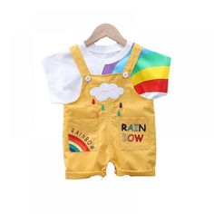 1-4Y Toddler Unisex Summer Sets Rainbow Print T-shirt Short Sleeves And Jumpsuits Two-piece Set Wholesale Multicolor Cotton Sets With Crew Neck, Multicolor Cotton Crew Neck Sets, Multicolor Crew Neck Sets With Letter Print, Summer Playtime Sets With Crew Neck, Summer Playtime Crew Neck Sets, Sleeveless Cotton Set With Cartoon Print, Sleeveless Cotton Cartoon Print Sets, Playful Rainbow T-shirt For Summer, Fun Rainbow Short Sleeve T-shirt