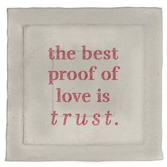 the best proof of love is trust embroidered on a white linen square with red thread