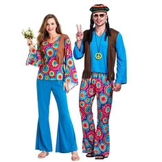 man and woman dressed in hippie costumes standing next to each other with peace signs on their hands