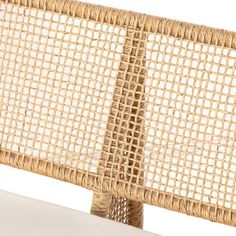 the back end of a wicker bench made out of wood and rattan weave