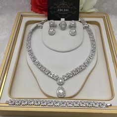 Sparkle and shine like never before with the range of cz diamond cubic zirconia silver plated bridal necklace set with matching earrings. This beautiful cubic zirconia encrusted necklace set is the perfect accessory  for your wedding day. Beautiful elegant, this silver cubic zirconia necklace set is filled with the dazzling sparkle. Guaranteed to transform your look in seconds to gain instant luxury, this stunning necklace set will ensure you steal every spotlight. Bring the dazzle into your out Cubic Zirconia Jewelry Sets For Anniversary, Anniversary Diamond Cut Cubic Zirconia Jewelry Sets, Anniversary Jewelry Sets With Diamond Cut Cubic Zirconia, Anniversary Jewelry Sets With Diamond-cut Cubic Zirconia, Brilliant Cut Cubic Zirconia Jewelry Sets For Anniversary, Brilliant Cut Crystal Jewelry Sets For Anniversary, Anniversary Jewelry Sets With Brilliant Cut Crystals, Silver Diamond Cut Jewelry Sets For Anniversary, White Gold Jewelry Sets With Sparkling Stones For Anniversary