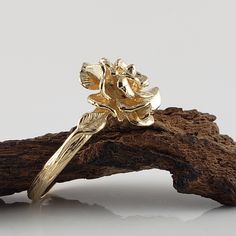 Made to Order Beautiful Hand Sculpted Rose Ring cast in solid Gold with two small leaves on each side. Available in Sterling Silver, 14k or 18k Gold in Yellow, White, and Rose Gold (Silver $150, message for customer purchase link) Size: Rose is 14.23mm wide Band width is 2.66mm ● Gold rings will come a black velvet ring box. ● Silver Rings will come in a mesh tote and gift box. dvjewelrydesigns.com Dawn Vertrees Jewelry...Elegance Uncut. #168 Rose Design Flower Ring For Anniversary, Gold Flower Ring With Rose Design, Flower Shaped Rose Ring For Anniversary, Gold Rose Design Flower Ring, Gold Flower Ring With Rose Design For Anniversary, Gold Flower Ring With Rose Design For Wedding, Wedding Gold Flower Ring With Rose Design, Yellow Gold Flower Ring With Rose Design For Wedding, Rose Engagement Ring Flower