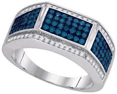 a ring with blue and white diamonds on it, set in 18k white gold