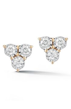 These heirloom-worthy studs feature a delicate trio of round diamonds haloed in the warmth of 14-karat gold. 1/8" drop; 3/8" width Post back Total diamond weight: 0.12ct. Color: G-H Clarity: SI 14k gold/diamond Imported Diamond Guide Fine Jewelry Three Stone Diamond Earrings, Three Stone Diamond Earrings In Fine Jewelry Style, Three-stone Diamond Earrings For Wedding, Three Stone Diamond Earrings In Yellow Gold, Wedding Diamond Earrings With Three Stones, Diamond White Three Stone Earrings For Anniversary, Elegant Diamond White Three Stone Diamond Earrings, Three Stone Diamond Earrings For Anniversary, Anniversary Three-stone Diamond White Earrings