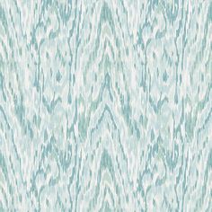 a blue and white wallpaper with an abstract pattern on it's surface,