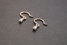 14k gold filled / sterling silver wire and freshwater pearls drop earrings. Just twist them slightly to the back for a tiny hoop look. g o l d . f i l l Gold-fill is an actual layer of gold bonded with pressure to another metal, usually brass or copper. Gold-fill is not to be confused with gold plating as gold-fill has a much thicker layer of gold. Gold filled jewelry does not flake off or rub off and with proper care it can last a lifetime. s t e r l i n g . s i l v e r Sterling silver is an al Dainty Rose Gold Pearl Earrings 14k Gold Filled, Dainty Rose Gold 14k Gold-filled Pearl Earrings, Dainty Wire Wrapped Pearl Earrings In 14k Gold, Dainty Wire Wrapped 14k Gold Filled Pearl Earrings, Dainty 14k Gold Filled Pearl Earrings, Dainty 14k Gold Pearl Earrings, Earrings Gold Pearl, Small Pearl Earrings, Pearl Earrings Gold