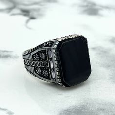 "925 Sterling Silver Square Stone Men's Ring, Black Onyx Stone, Ottoman Fusion Oxidized Silver, Gift for Him, Flower Print on the Sides Ring  Ottoman Ring, Oxidized Ring, Turkish Handmade Ring It weighs approximately  12  grams. Head Size : 13 mm X 18 mm Elevate his style with our 925 Sterling Silver Square Stone Men's Ring, a perfect blend of modern design and Ottoman inspiration. Crafted with meticulous attention to detail, this ring features a striking Black Onyx stone set in an oxidized silv Luxury Adjustable Black Rings, Luxury Black Signet Ring Stamped 925, Ottoman Inspiration, Mens Ring Designs, Unique Mens Rings, Oxidized Ring, Square Stone, Black Onyx Stone, Ring Black