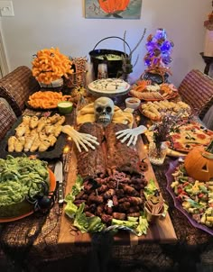 a table filled with halloween food and decorations