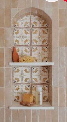 a shelf with some food on it in a room that has tile walls and flooring