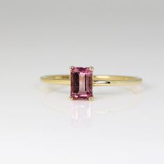 Elegant Pink Topaz Ring In 14k Gold, Elegant Yellow Gold Tourmaline Emerald Ring, Elegant Emerald Cut Tourmaline Ring, Elegant Emerald-cut Tourmaline Ring, Tourmaline Solitaire Jewelry As Gift, Yellow Gold Tourmaline Solitaire Jewelry, Elegant Ruby Birthstone Ring With Tourmaline, Tourmaline Solitaire Jewelry For Gift, Tourmaline Solitaire Jewelry Gift