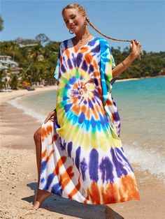 Introducing the Rainbow Tie-dye Print Dress! This summer dress is perfect for a day at the beach or just chilling at home. Made from soft fabric, it's comfortable to wear and features a tie-dye print that's sure to turn heads. The batwings sleeves and loose fit make it perfect for hot summer days, while the tie-dye branding adds a touch of style. Rock this dress on the beach or anywhere else your summer takes you! Specifications Sleeve Style: Batwing Sleeve Silhouette: Straight Neckline: V-Neck Tie Dye Long Dress For Beach Cover-up, Casual Tie Dye Dress For Beach Cover-up, Beach Tie-dye Free Size Kaftan, Cheap Tie-dye Beach Dresses, Overalls Plus Size, Hand-dyed Tie-dye Kaftan For Beach, Instagram Dress, Summer Dress, Rainbow Tie